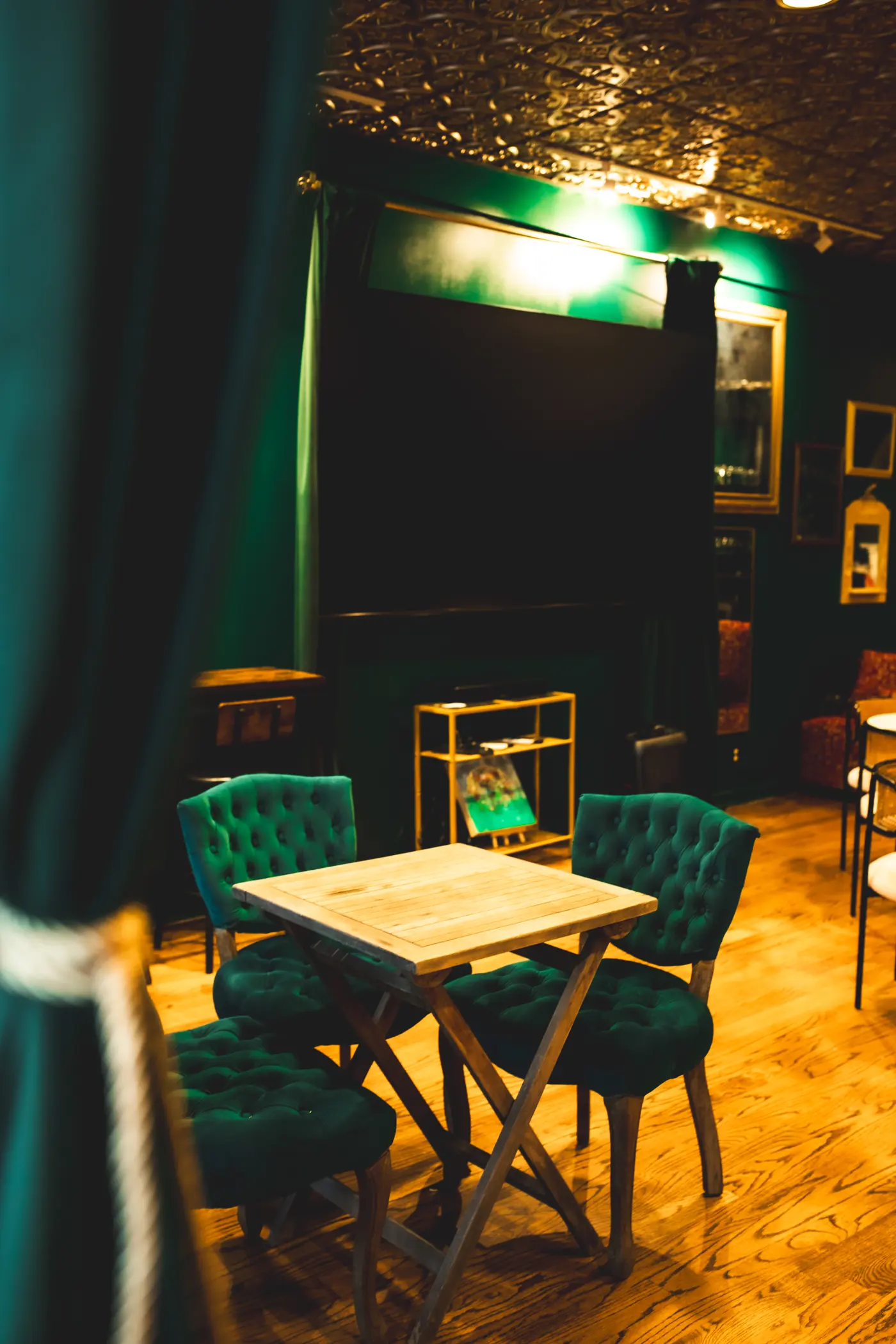 Green velvet seating in The Rock's private event space